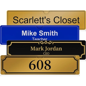 Detail showing acrylic office door signs in blue, black, and gold with custom engraving