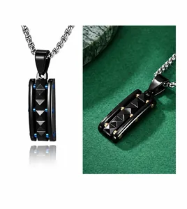 Detailed view of punk style rectangular pendant with golden geometric pyramid accents