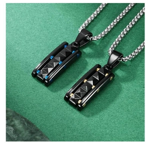 Detail of two-tone pyramid pendants with diamond texture and metallic dot accents