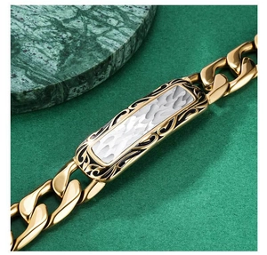 Macro detail of men's gold stainless steel bracelet with white pearl resin inlay