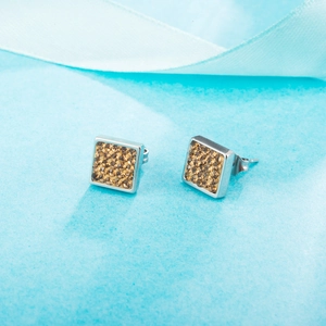 Square stainless steel stud earrings with pave-set champagne rhinestones from a 45-degree angle