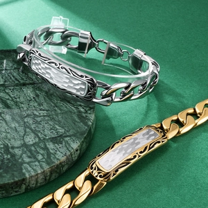 Men's stainless steel curb chain bracelet with hand-hammered texture and floral engraving
