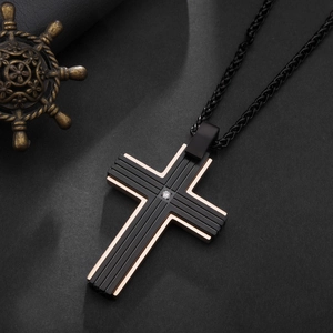 Two-tone black and rose gold stainless steel cross necklace with central cubic zirconia stone