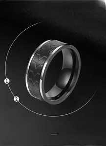Detailed close-up of a silver stainless steel ring featuring a black tire tread pattern
