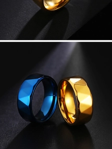 Detailed view of gold and blue faceted geometric stainless steel rings for men