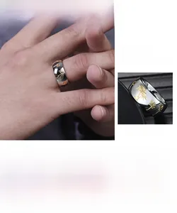 Detail showing polished stainless steel band with golden palm tree engravings