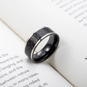 Polished stainless steel band ring with black tire tread wave pattern on open book