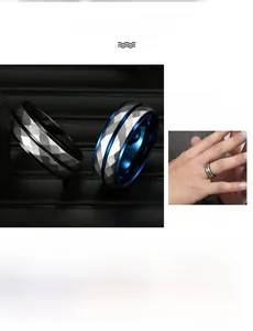 Detail of faceted titanium steel men's ring with polished dual-tone geometric finish
