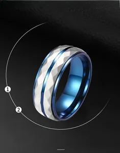 Detail of men's titanium steel ring with silver diamond-cut texture and blue inner band