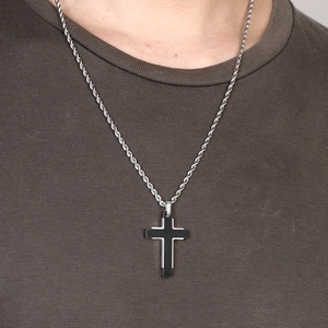Two-tone black and silver stainless steel cross pendant with rope chain on model
