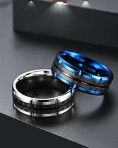 Macro detail of men's stainless steel rings with black carbon fiber inlay and polished edges