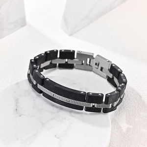 Bracelet pour homme en acier inoxydable avec maillons noirs et accents argentés style industriel