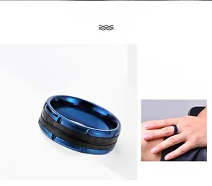 Detail of blue and black carbon fiber ring with textured edges and polished steel finish