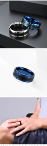 Close-up of men's stainless steel ring with carbon fiber inlay and gear edge