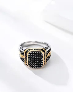 Macro detail of men's vintage signet ring with black rhinestones and gold accents