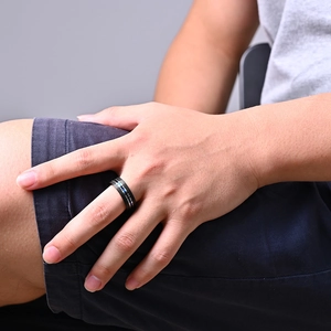 Men's titanium steel ring with black band and blue strip inlay in industrial style