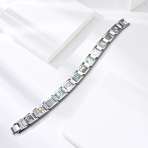 Minimalist tungsten couple bracelet featuring abalone shell inlays on polished metal links