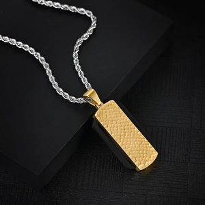Men's two-tone stainless steel necklace with hammered gold rectangular pendant on black base