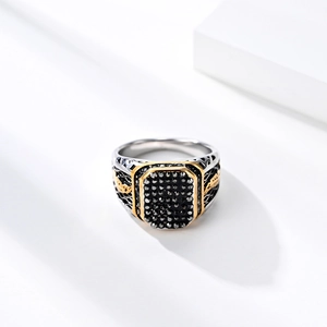 Men's vintage stainless steel ring featuring black gemstones and gold floral engraving