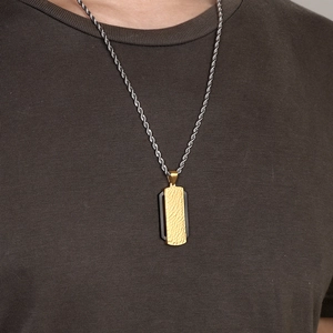 Men's two-tone hammered rectangle pendant with silver rope chain on a brown t-shirt