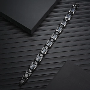 Men's pure titanium magnetic bracelet with carbon fiber inlay on black striped background