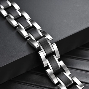 Men's titanium steel bracelet with black carbon fiber inlays and brushed H-link design