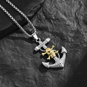 Men's anchor skull pendant necklace in stainless steel on textured stone surface