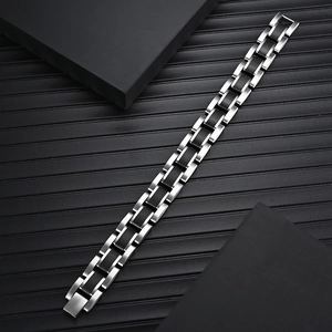 Men's titanium steel bracelet with black carbon fiber links in industrial style