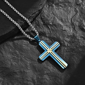 Blue brushed stainless steel cross necklace with gold trim and crystal on a box chain