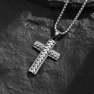 Mens vintage stainless steel cross pendant with woven texture on industrial rock base