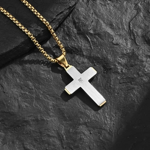Two-tone brushed stainless steel cross pendant necklace with zircon on rock background