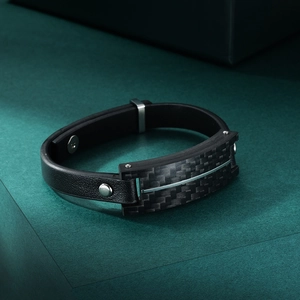 Men's black leather bracelet with carbon fiber inlay and metallic rivet accents
