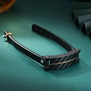 Men's black leather bracelet with carbon fiber inlay and golden U-shaped metal clasp