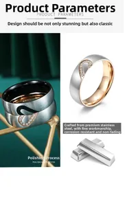 Detail of brushed stainless steel couple rings with heart puzzle and zircon stones