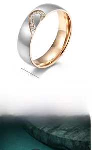 Detail of 6mm brushed titanium steel ring with heart cutout and zircon inlay design