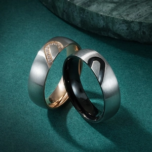 Titanium steel couple rings featuring complementary heart designs in silver and rose gold