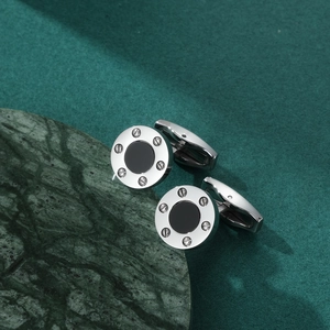 Vintage round stainless steel cufflinks with black onyx inlay and decorative screw design