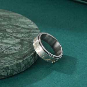 Stainless steel spinning ring with gold star and moon patterns for stress relief
