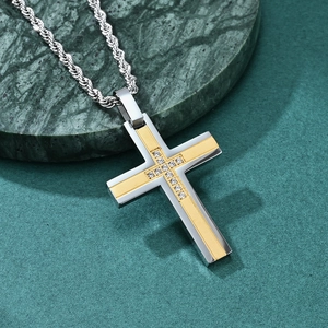Men's two-tone stainless steel cross pendant necklace with diamonds on marble base