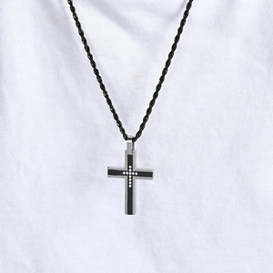 Titanium steel cross necklace with inlaid crystals and a black braided rope chain
