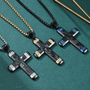 Two-tone cross pendant necklace in stainless steel with carbon fiber texture inlay