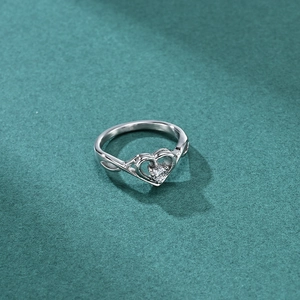 Elegant heart-shaped silver ring with central zircon and openwork wave band design