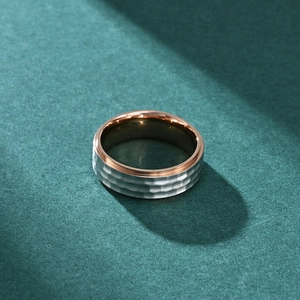 Men's titanium steel ring with silver hammered texture and rose gold inner band