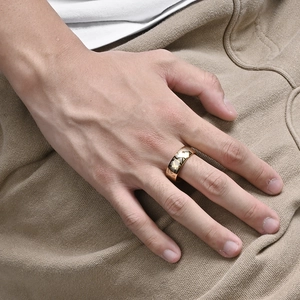 Minimalist gold stainless steel ring with Roman numeral cutouts and polished finish
