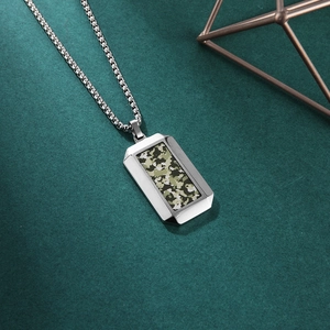 Men's stainless steel camo dog tag necklace with box chain on dark textured background