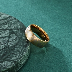 Minimalist cracked stainless steel ring with golden interior and geometric triangle pattern