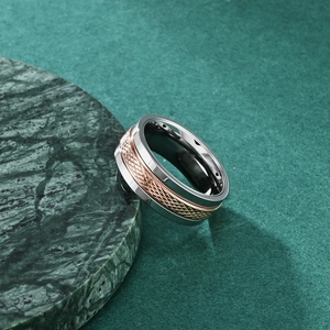 Two-tone stainless steel spinning ring with rose gold diamond pattern and silver edges
