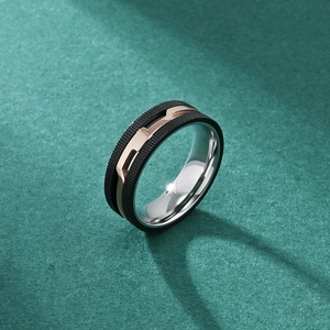 Three-tone industrial men's titanium steel ring with black matte texture and rose gold band