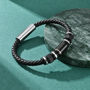 Men's black braided leather bracelet with silver textured metal rings and magnetic clasp