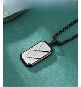 Detailed macro view of octagonal brushed stainless steel pendant with black frame chain